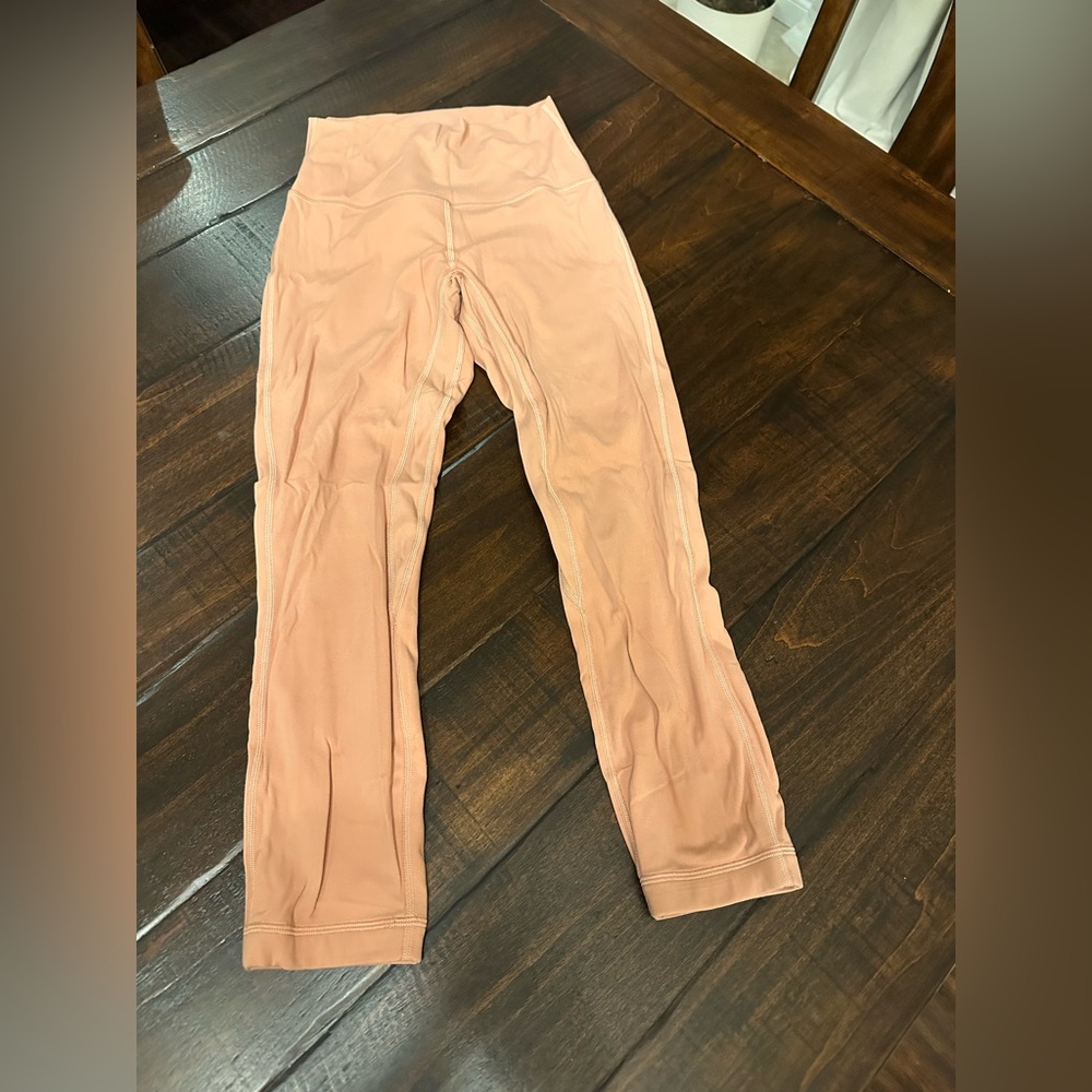 Lululemon cropped pants, terra-cotta colored, size 4. Excellent condition.